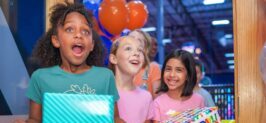 Three kids excited for Sky Zone birthday party